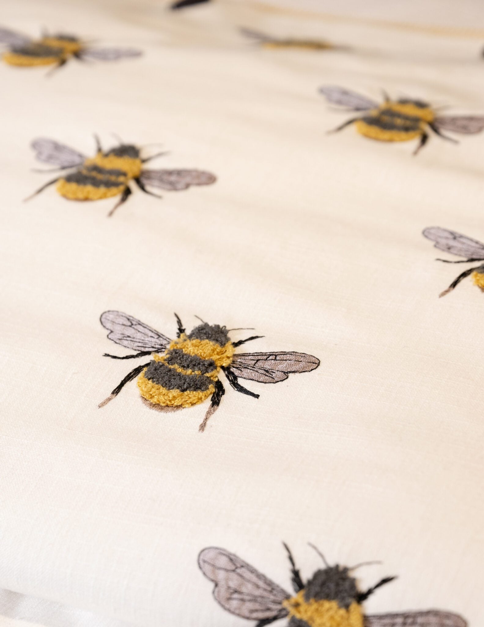 Buzzworthy embroidered Bee yellow black and white drapery bedding fabric by the yard from nell hill's