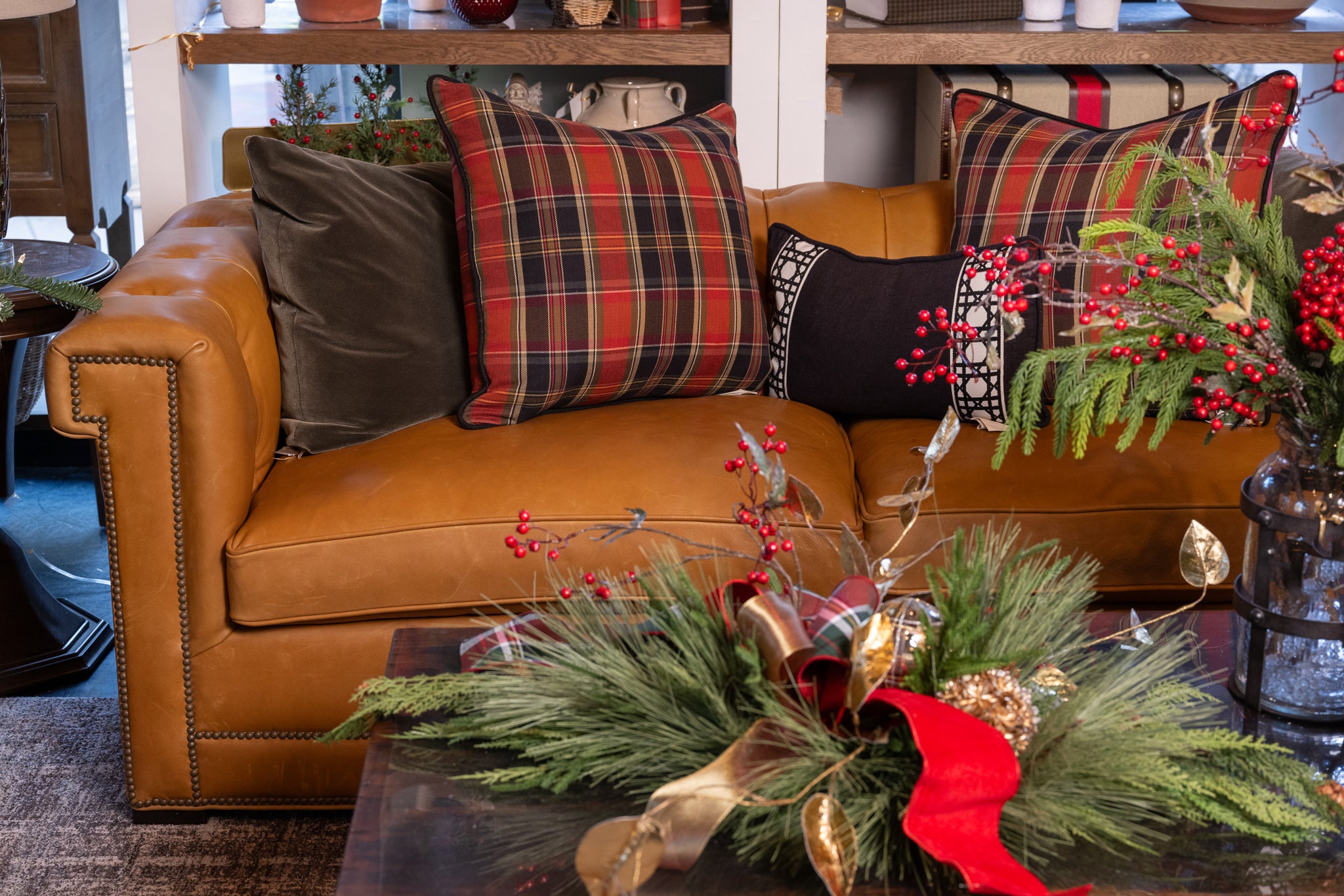 Apple Grove fabric by the yard from Nell Hill's in pillows on a sofa.