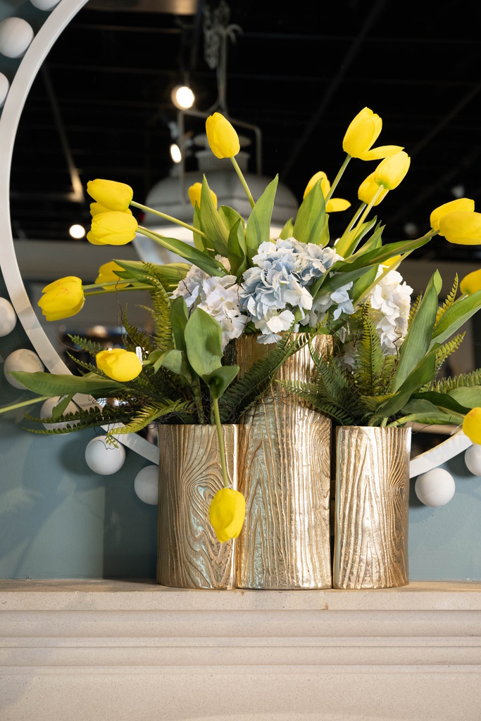 flower arrangement with three vessels