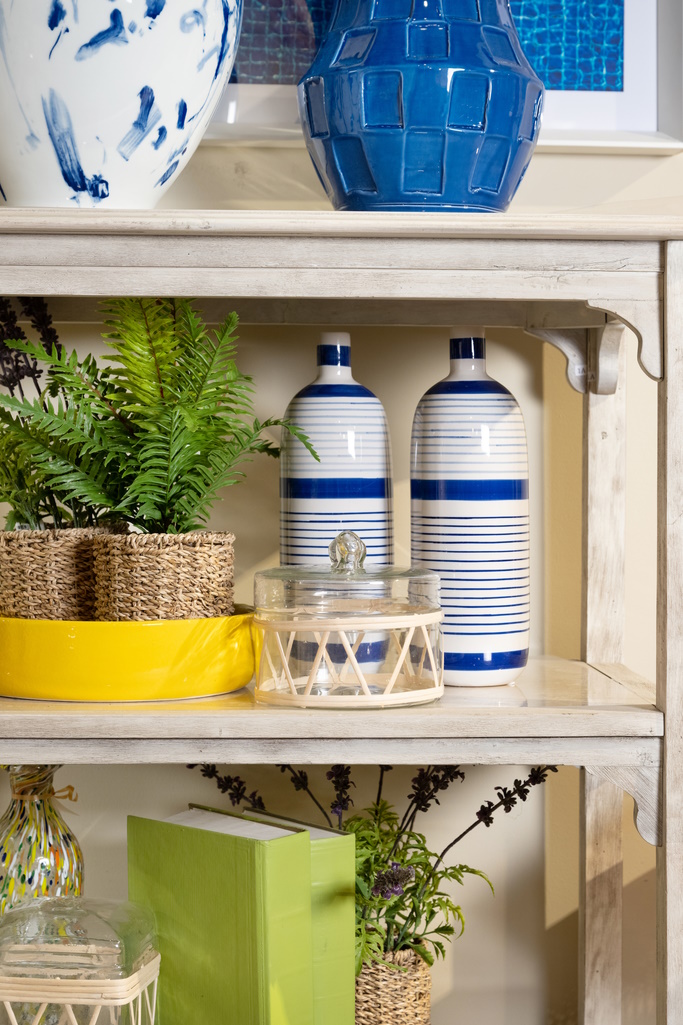 Rattan and glass cannisters add texture and interest to a cheery shelf