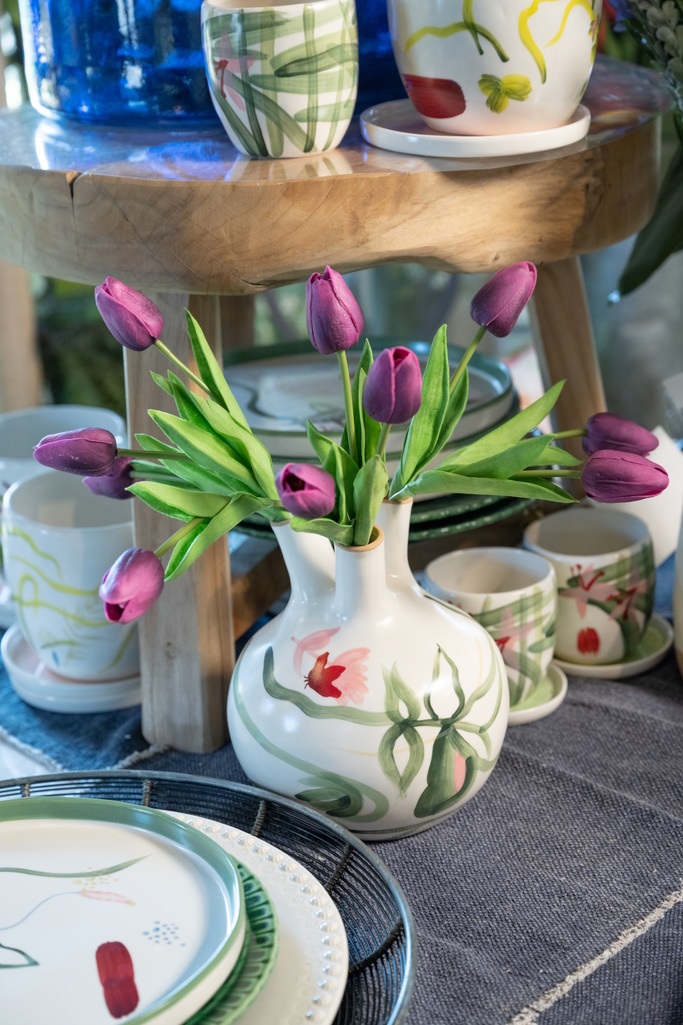 A hand-painted bud vase