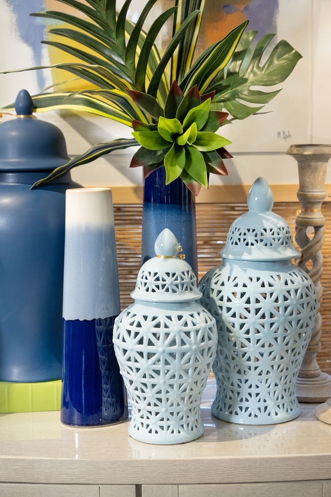 These lidded vases with geometric cutouts add whimsical texture to a tabletop display